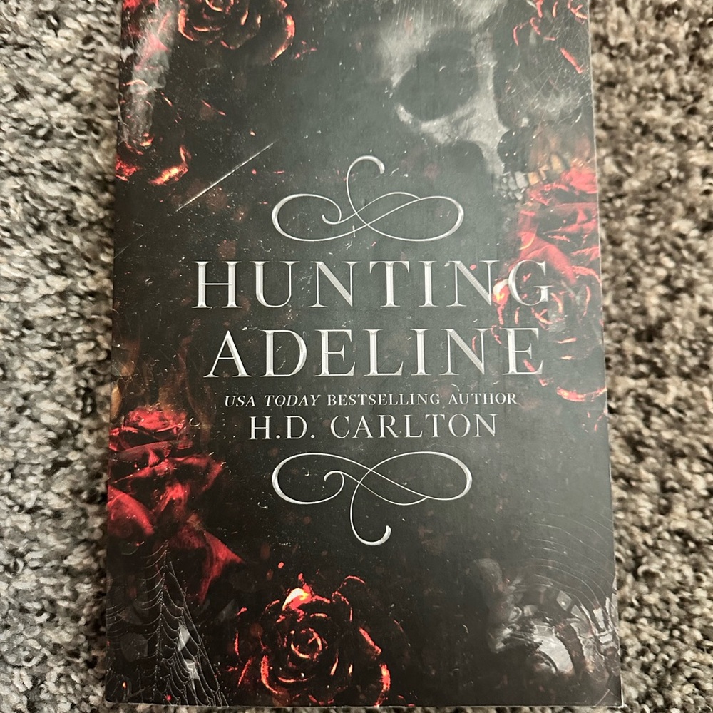 'Hunting Adeline' Book with Black and Red Cover